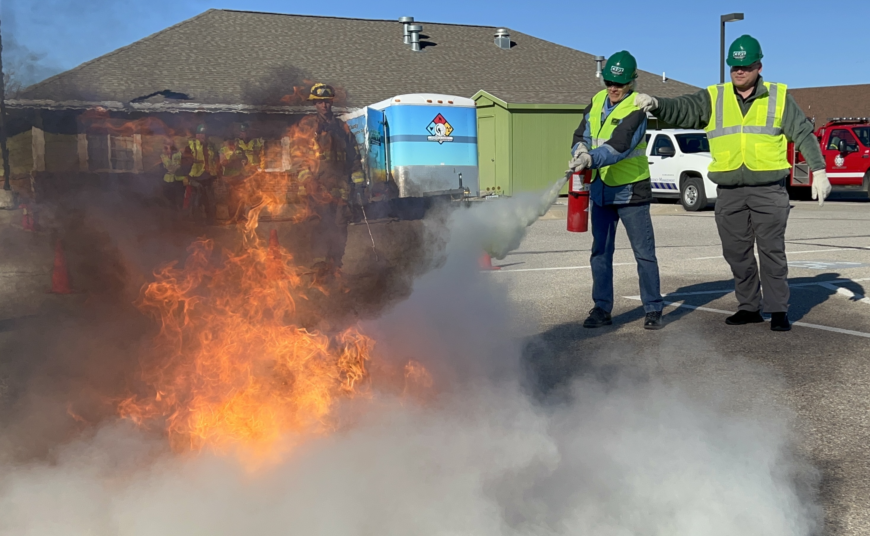 CERT volunteers putting out a fire during extinguisher training.