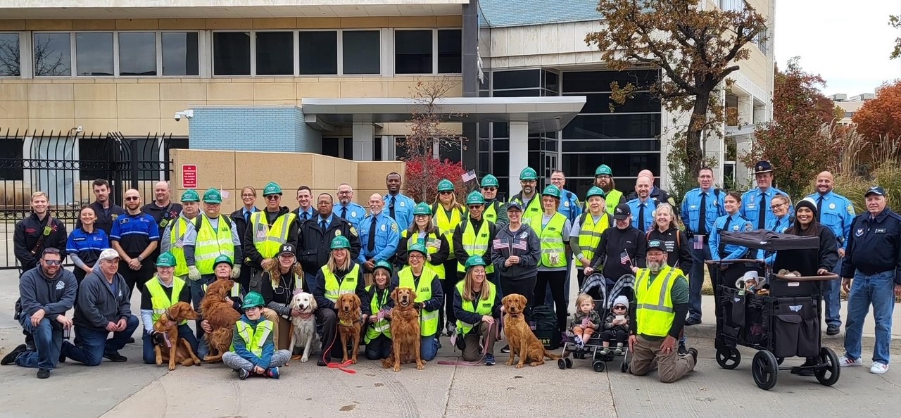 Volunteer teams with emergency responders in front of the Sedgwick County Courthouse