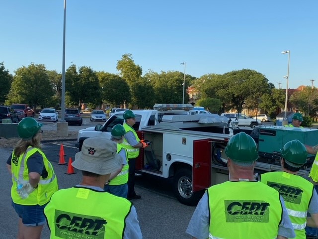 Volunteers listening to emergency responder before a search exercise